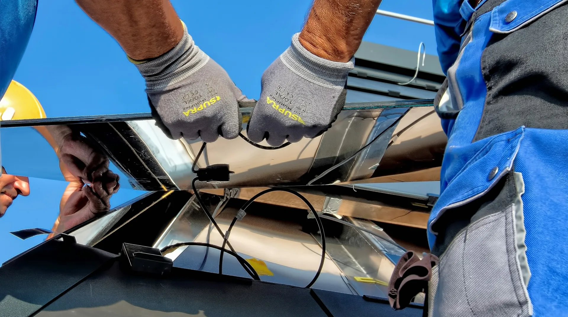 Technician installing a photovoltaic panel