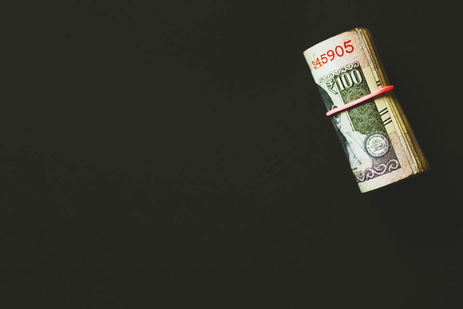Banknote and tape measure representing energy costs